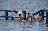 These children play where normally a fish market meets meters above the river