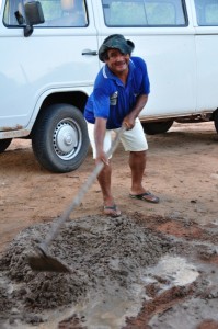 A local brother hard at work mixing concrete - the hard way