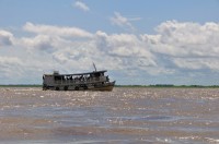 Out on the river you pass many a line boat transporting people and goods down the highway of the Amazon