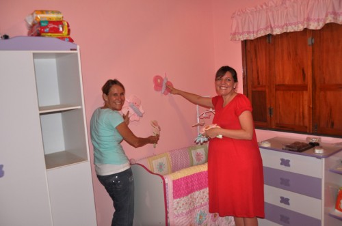Ruth and grandma Becky work on the baby's room!