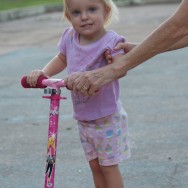Becca's not quite got the two-wheel balance thing down just yet.